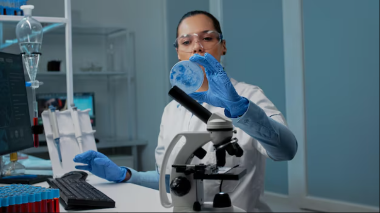 Researcher examining a sample in a laboratory, representing the Foundation's support of brain cancer research